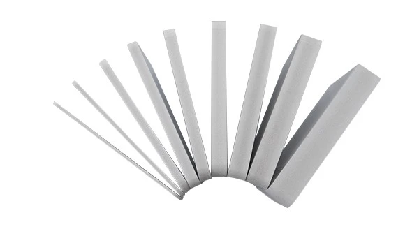 A cross-section sample of a Celuka-grade rigid foam PVC sheet A cross-section sample of a Celuka-grade rigid foam PVC sheet